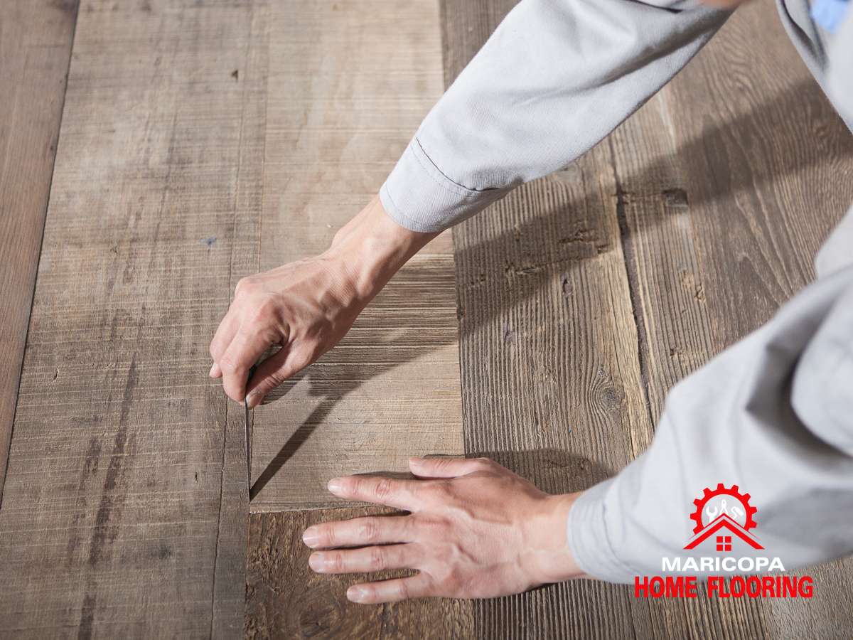 Installing Vinyl Plank Flooring with precision for a seamless, professional look.