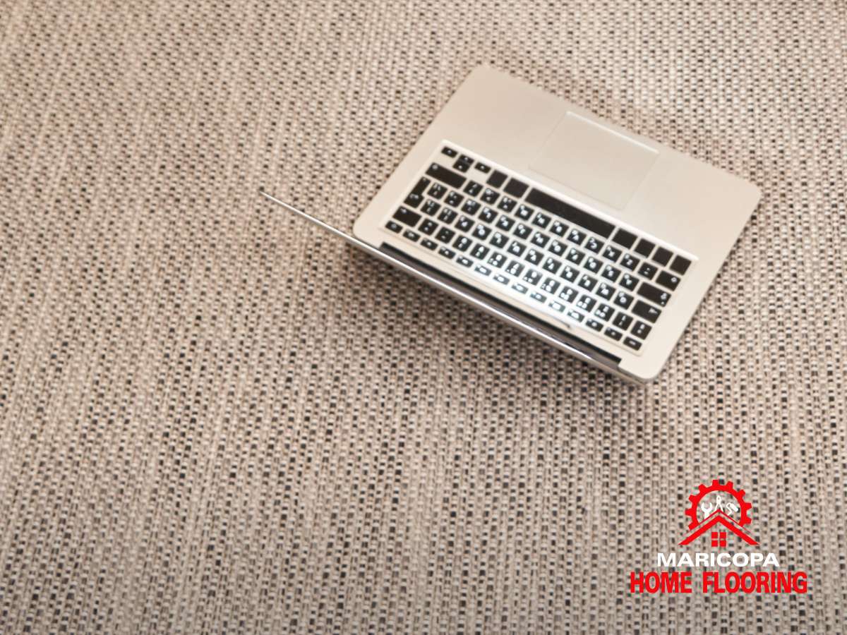 Laptop on textured Triexta Carpet flooring by Maricopa Home Flooring